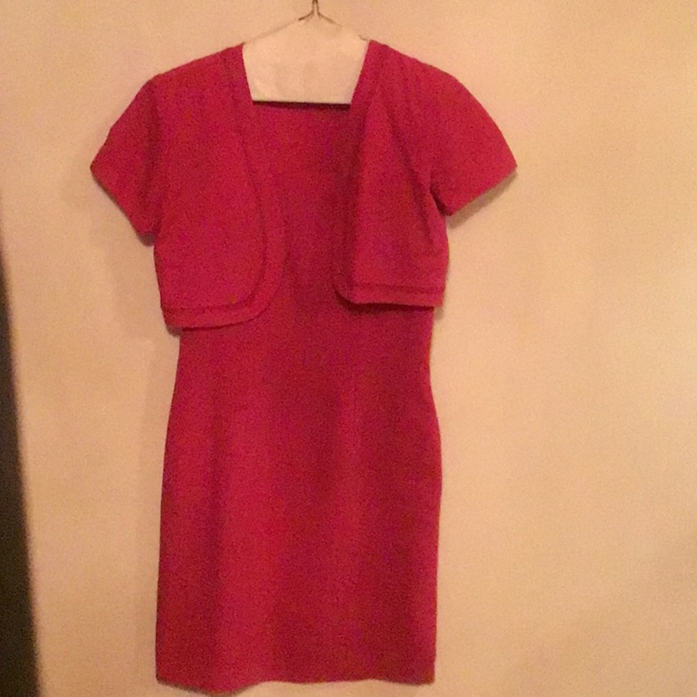 Pink sheath dress with matching bolero jacket.